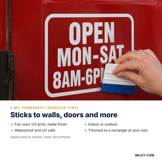 Applying a vinyl door decal with a squeegee