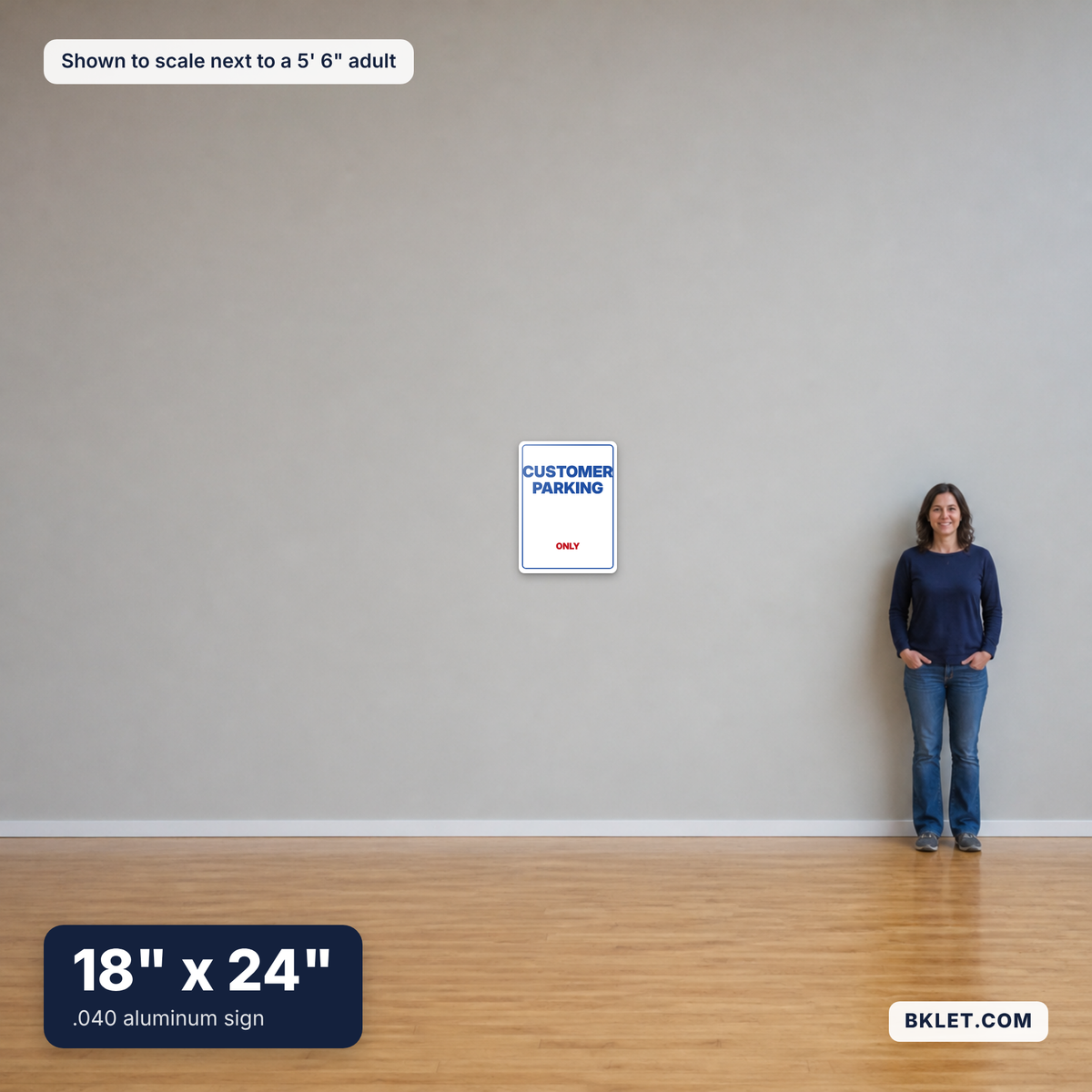 Aluminum sign, 18" x 24", shown to scale next to an adult