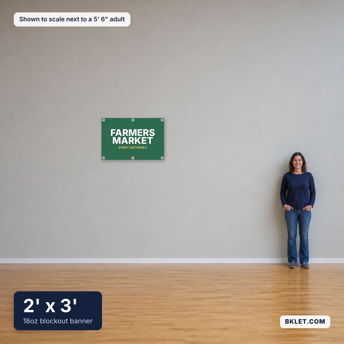18oz blockout banner, 2' x 3', shown to scale next to an adult