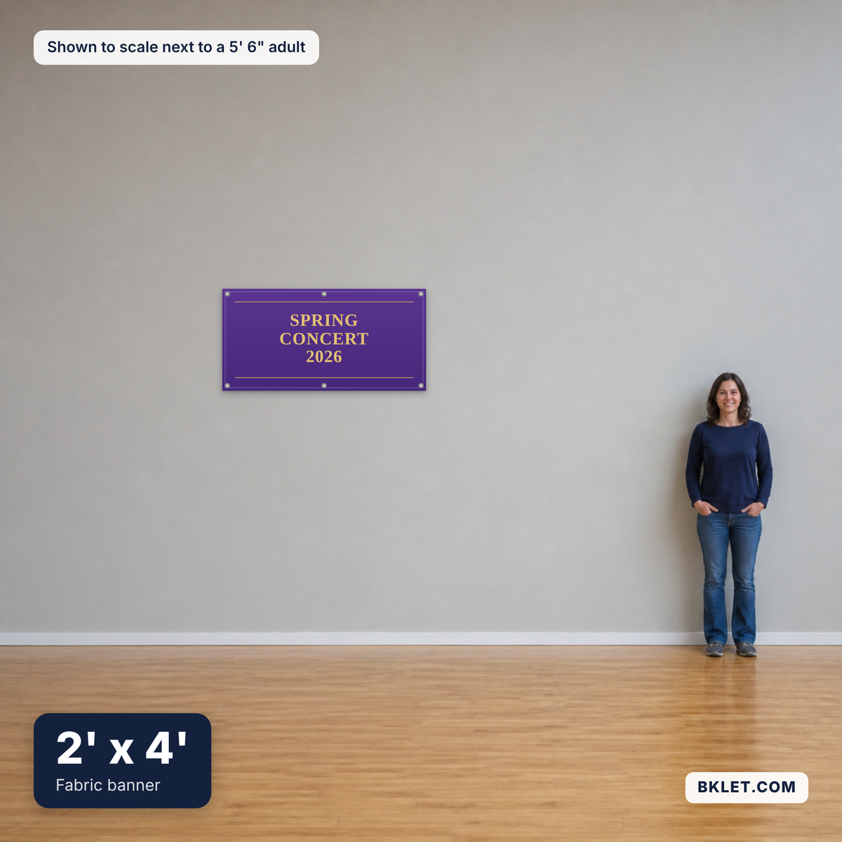 Fabric banner, 2' x 4', shown to scale next to an adult