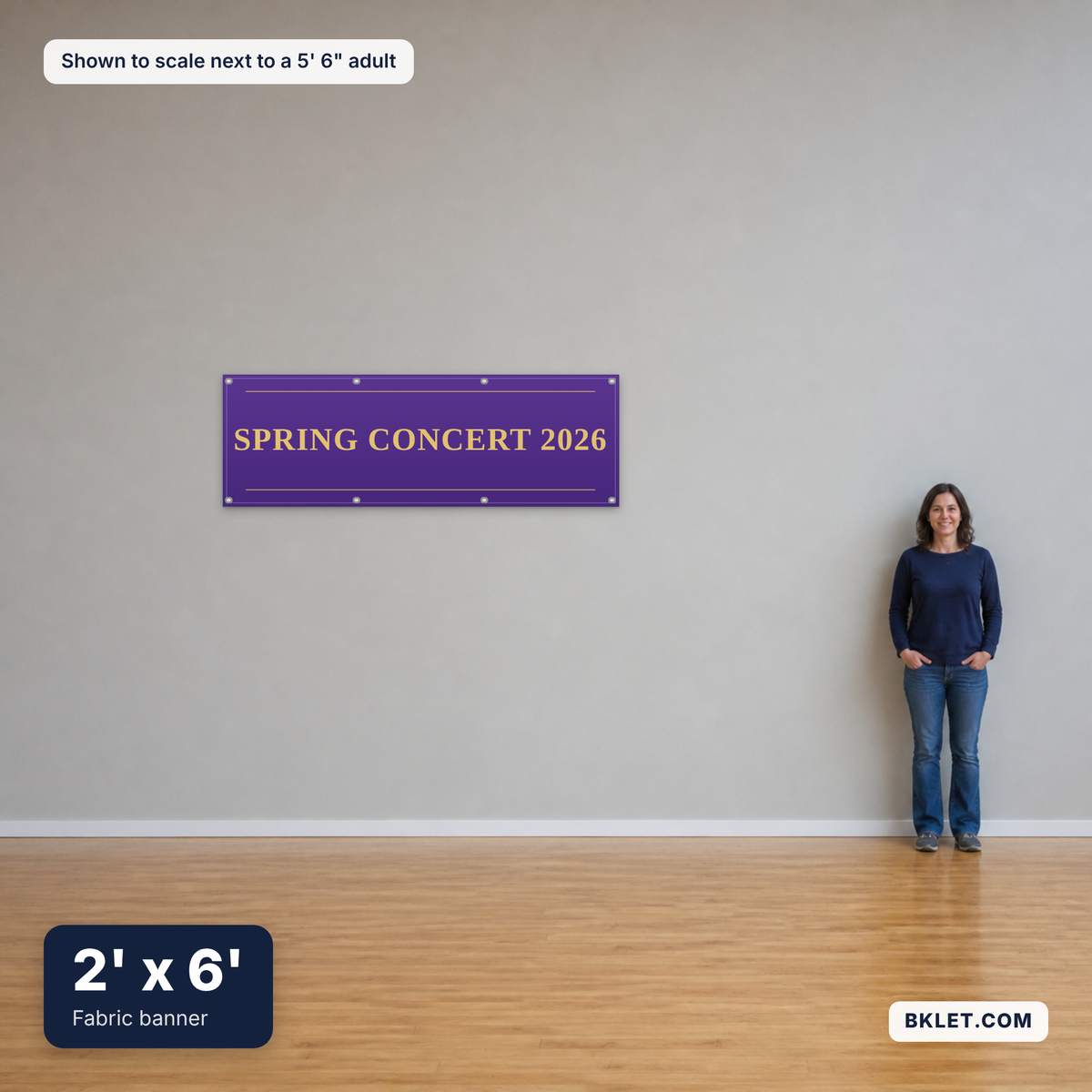 Fabric banner, 2' x 6', shown to scale next to an adult