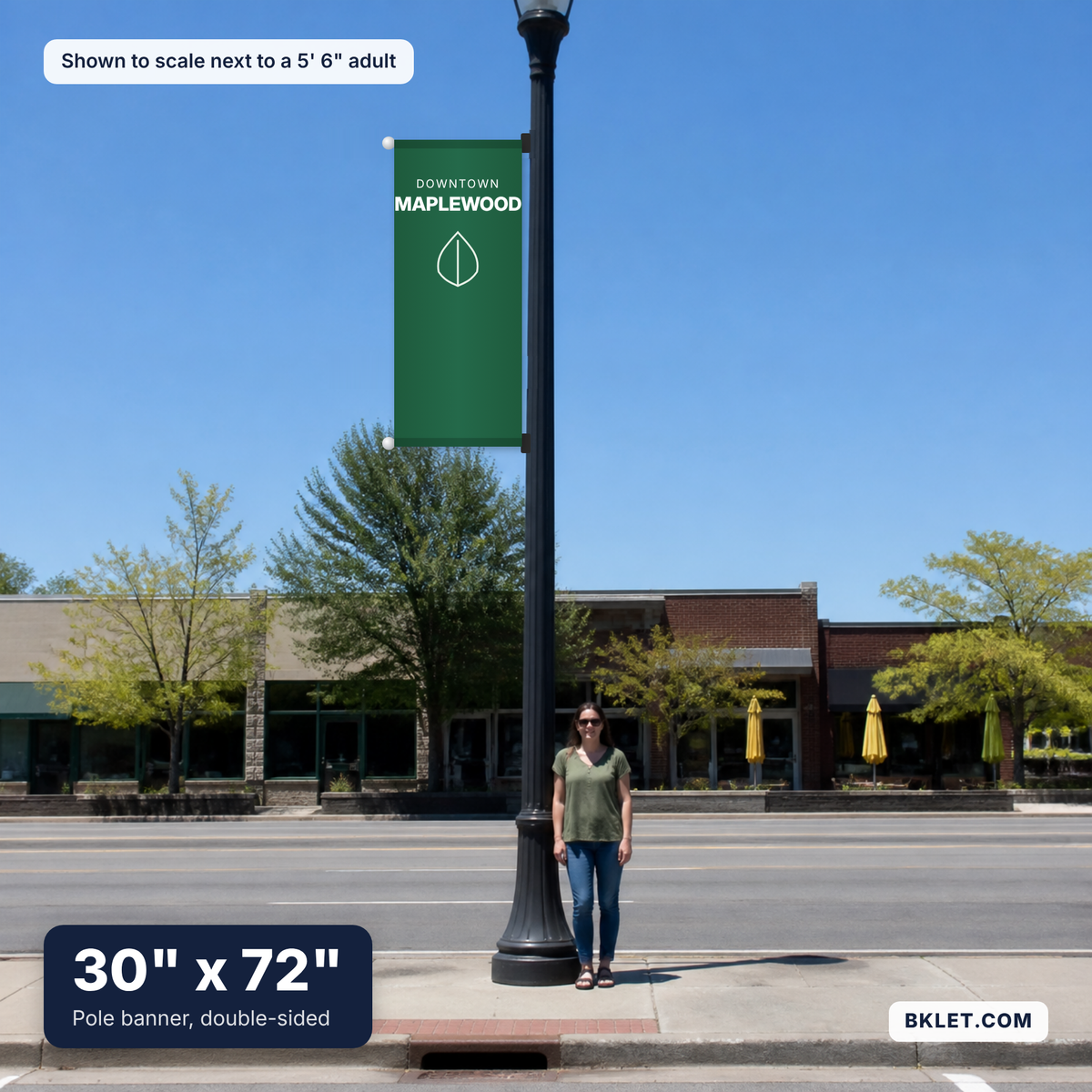 Pole banner, 30" x 72", shown to scale next to an adult
