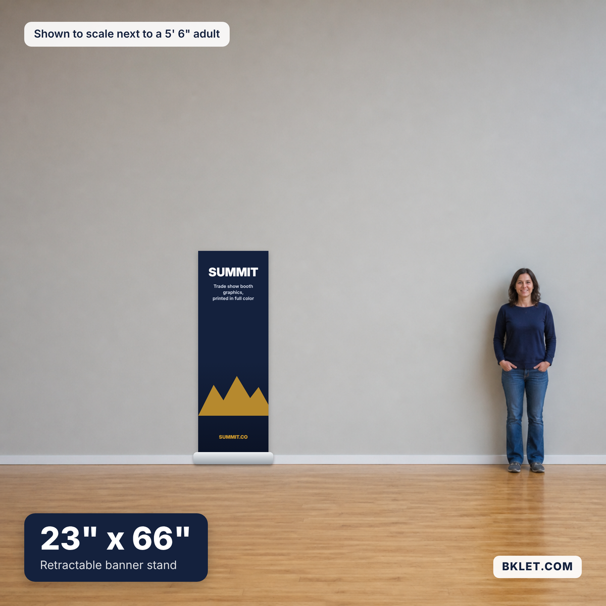 Retractable banner stand, 23" x 66", shown to scale next to an adult