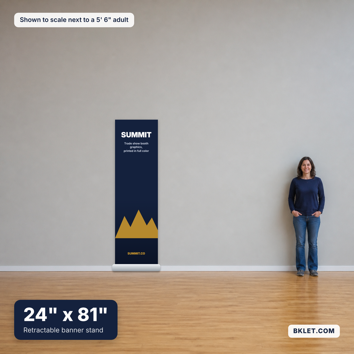Retractable banner stand, 24" x 81", shown to scale next to an adult