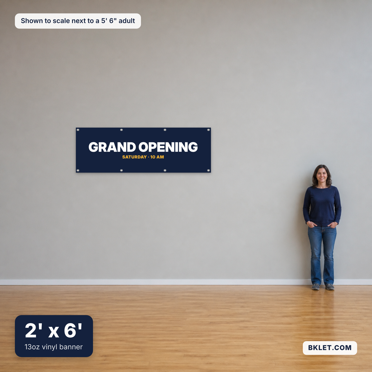 13oz vinyl banner, 2' x 6', shown to scale next to an adult