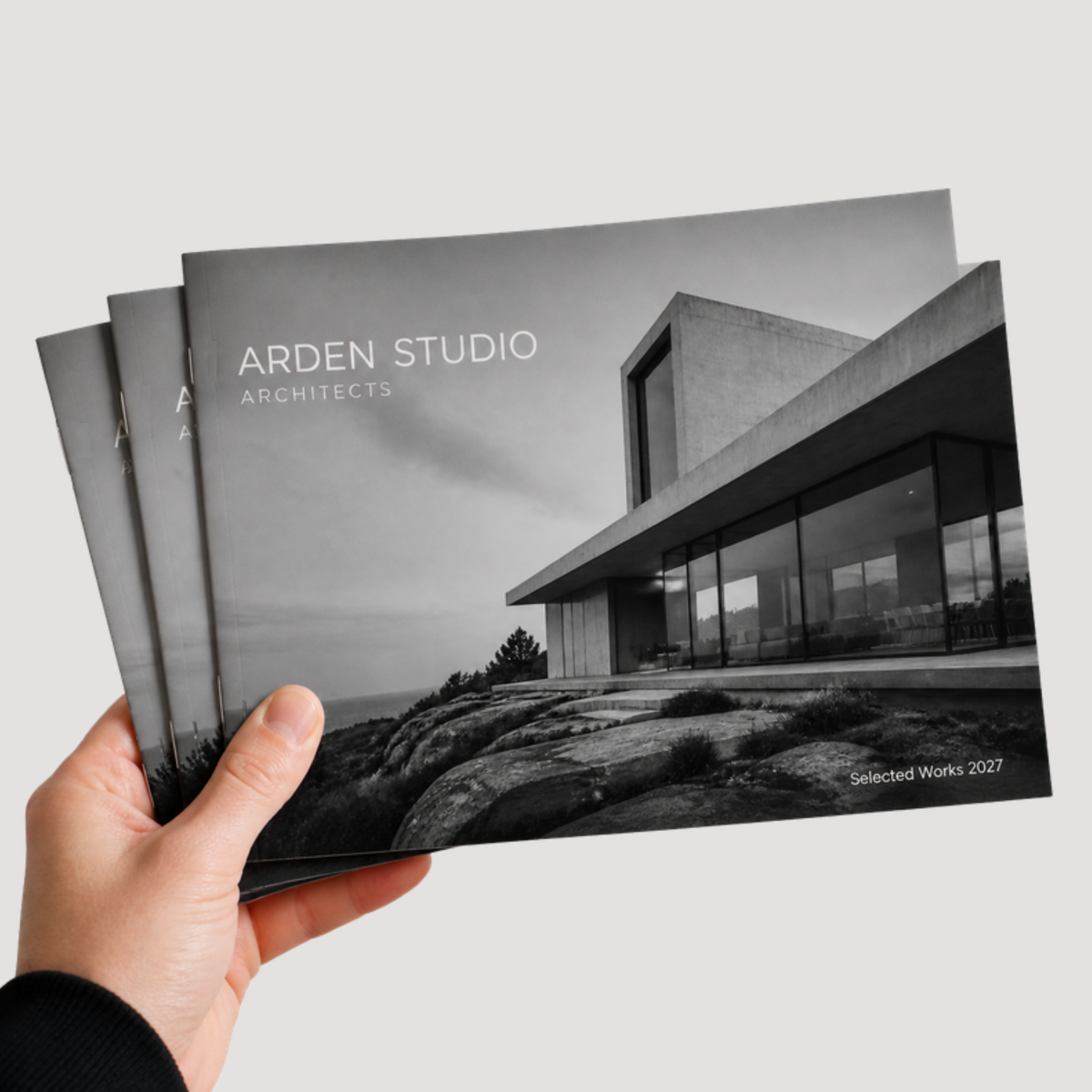 12 x 9 saddle-stitched all-cardstock booklet held in hand