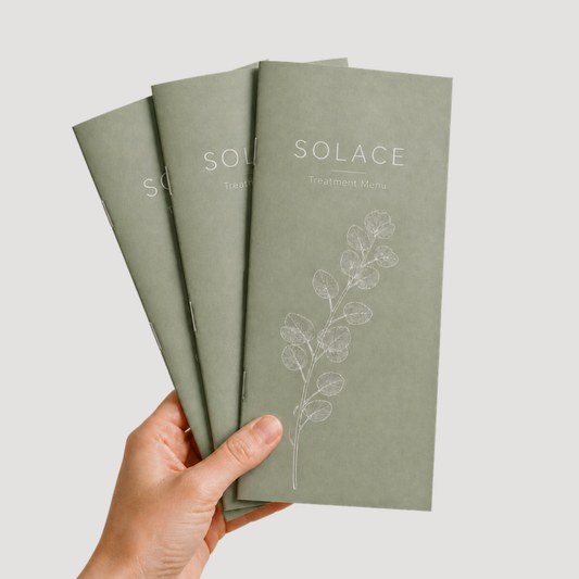 4 x 9 saddle-stitched all-cardstock booklet held in hand