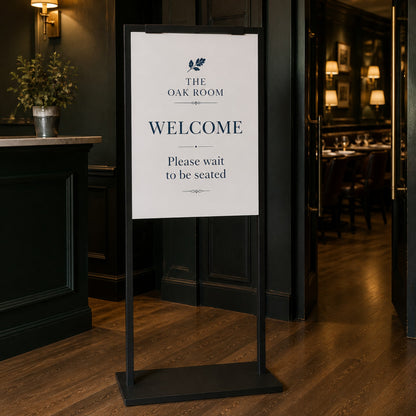 Black poster stand in a restaurant entry