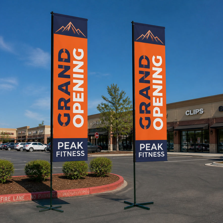 Two rectangle banner flags outside a storefront