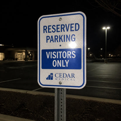 Reflective aluminum parking sign at night