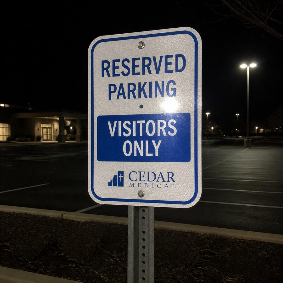 Reflective aluminum parking sign at night