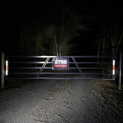 Reflective decal on a gate at night