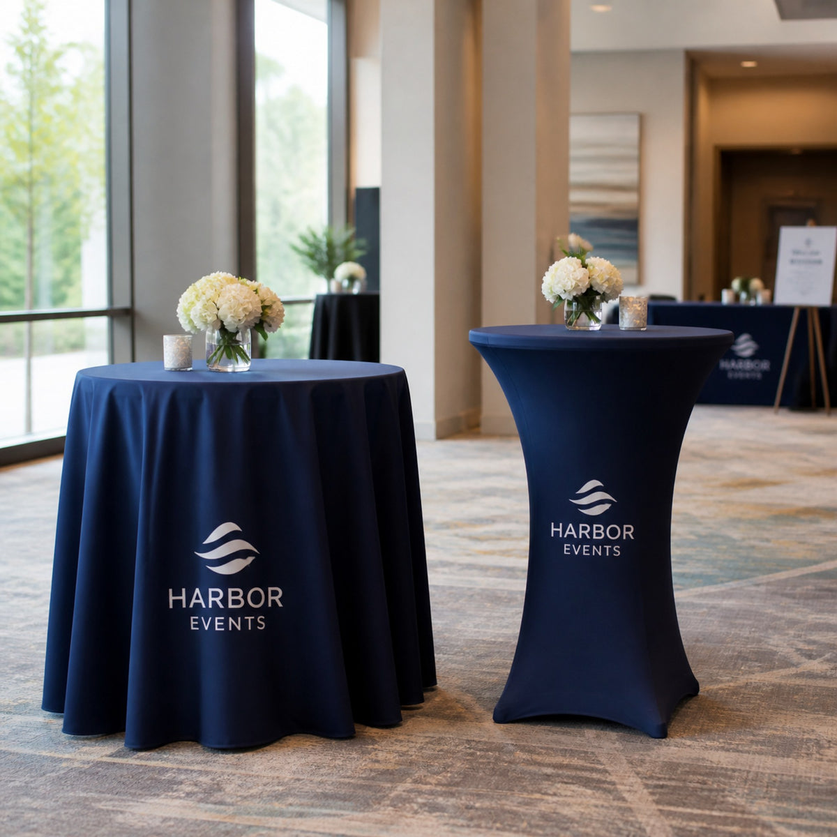 Printed fitted covers on a standard and a bar-height round table