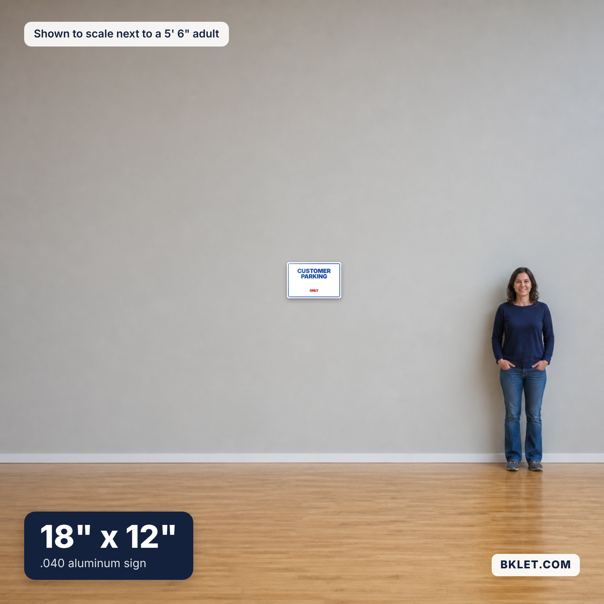 Aluminum sign, 18" x 12", shown to scale next to an adult