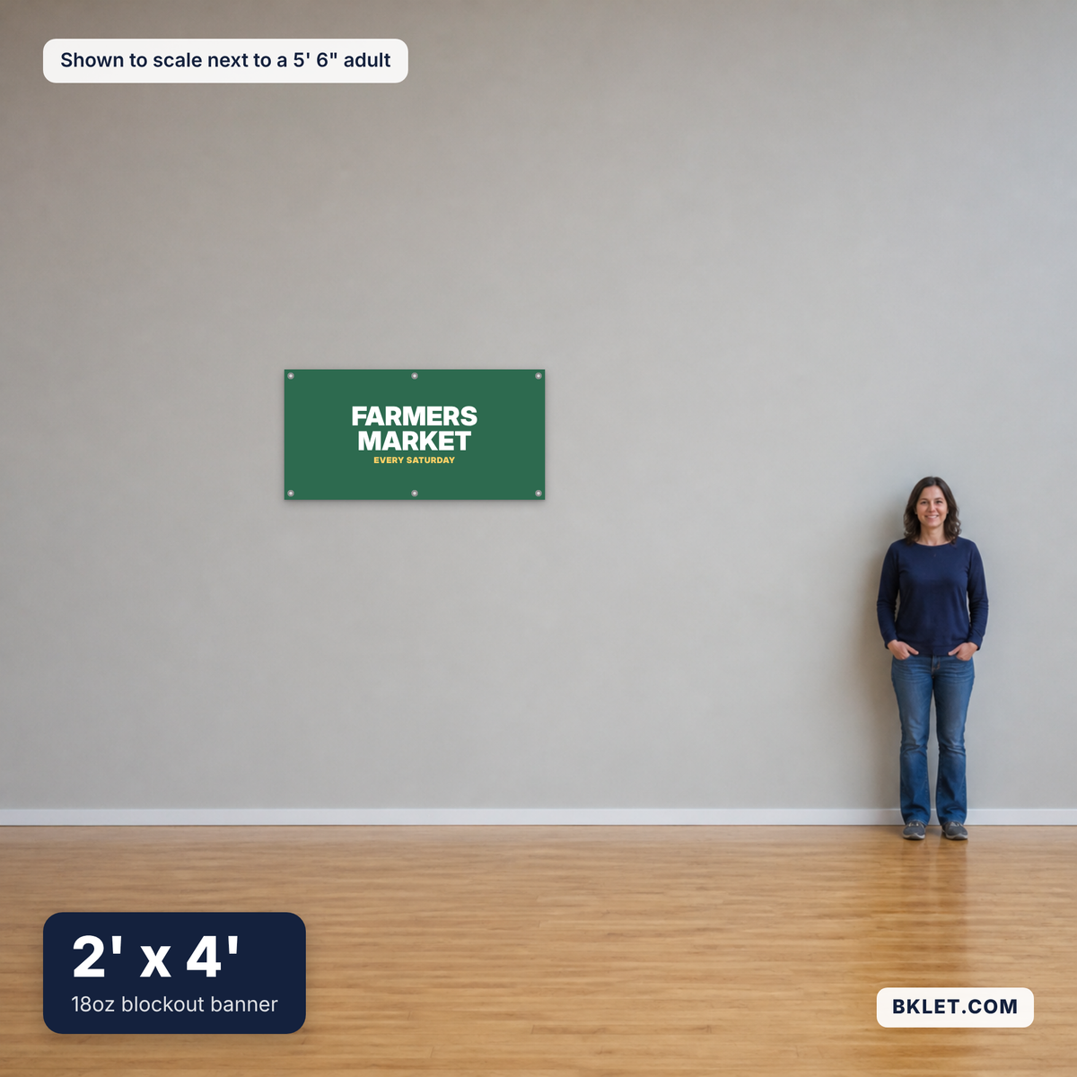 18oz blockout banner, 2' x 4', shown to scale next to an adult