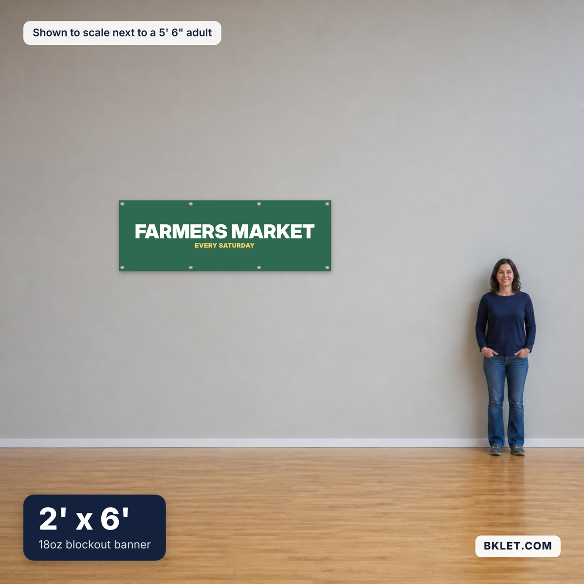 18oz blockout banner, 2' x 6', shown to scale next to an adult