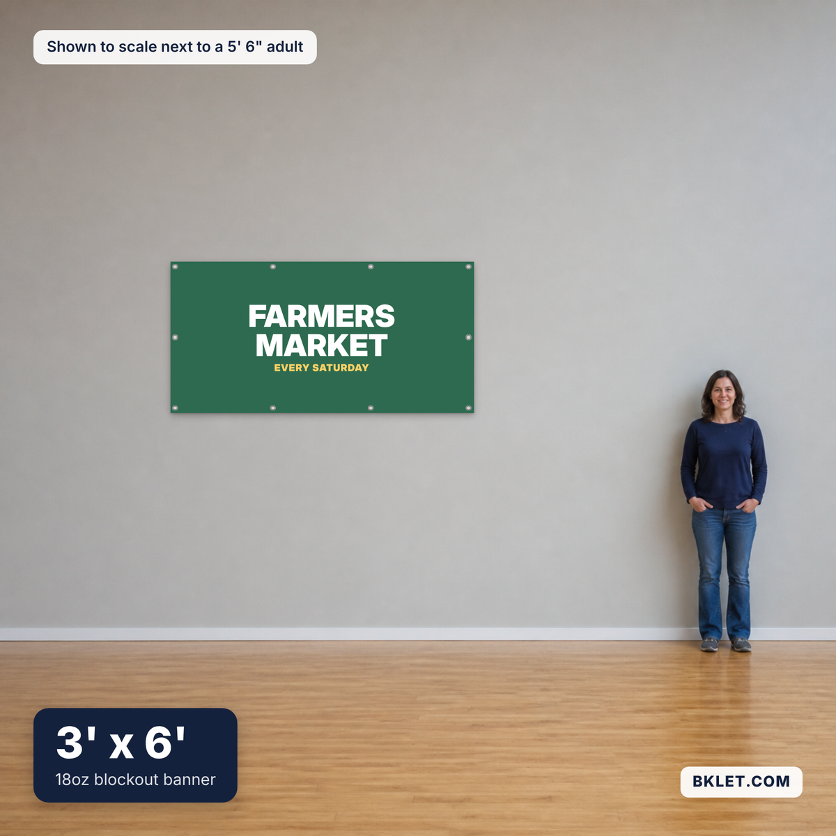 18oz blockout banner, 3' x 6', shown to scale next to an adult