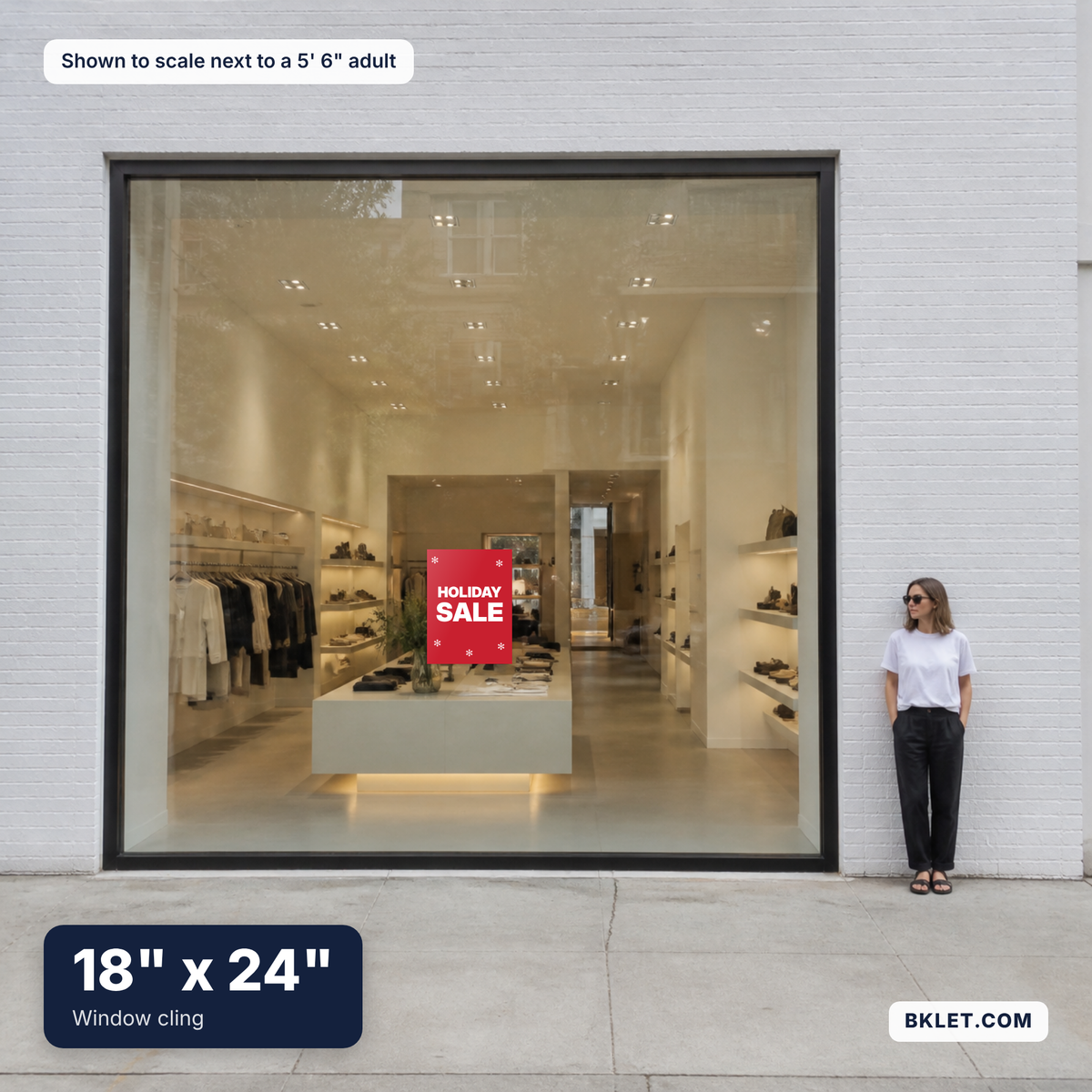 Window cling, 18" x 24", shown to scale next to an adult