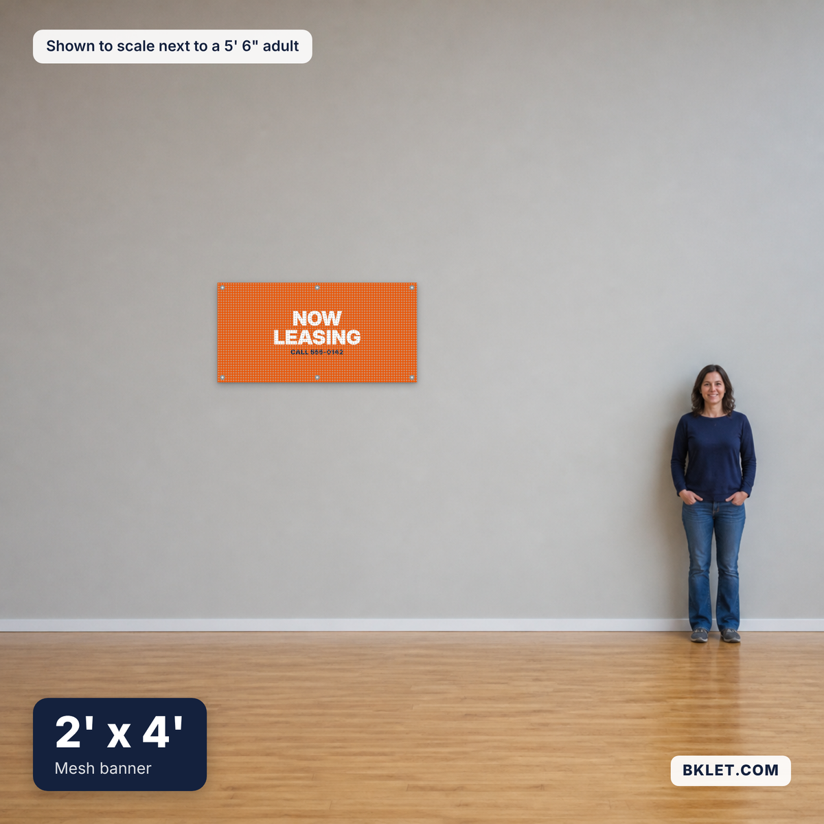 Mesh banner, 2' x 4', shown to scale next to an adult
