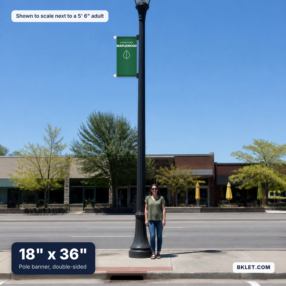 Pole banner, 18" x 36", shown to scale next to an adult