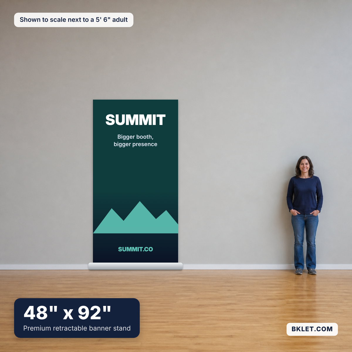 Premium retractable banner stand, 48" x 92", shown to scale next to an adult