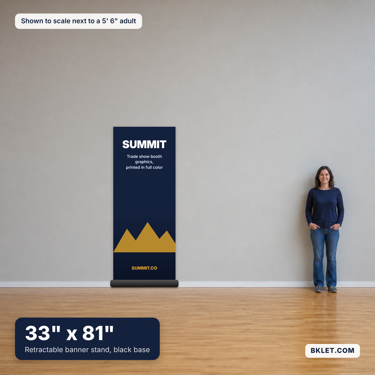 Retractable banner stand, 33" x 81", black base, shown to scale next to an adult