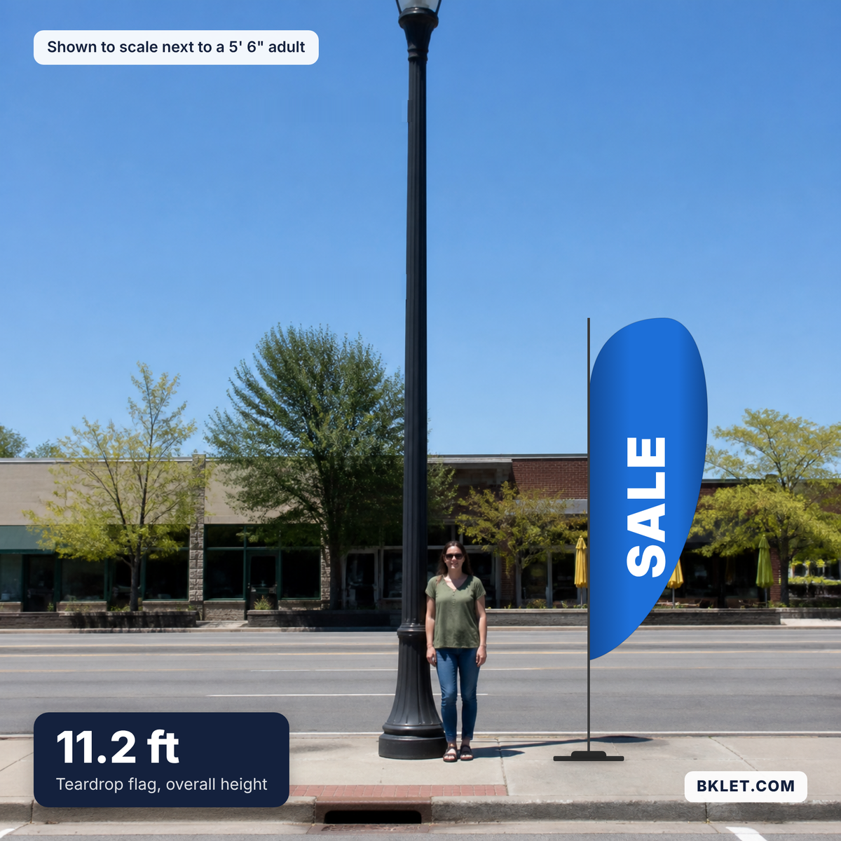 Teardrop flag, 11.2 ft overall, shown to scale next to an adult