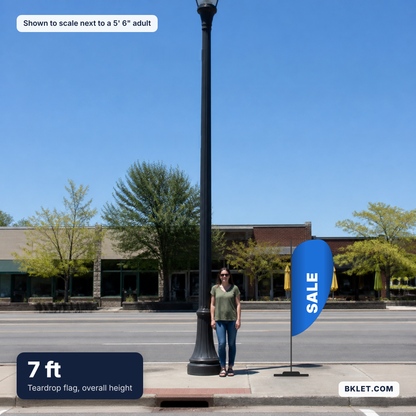Teardrop flag, 7 ft overall, shown to scale next to an adult