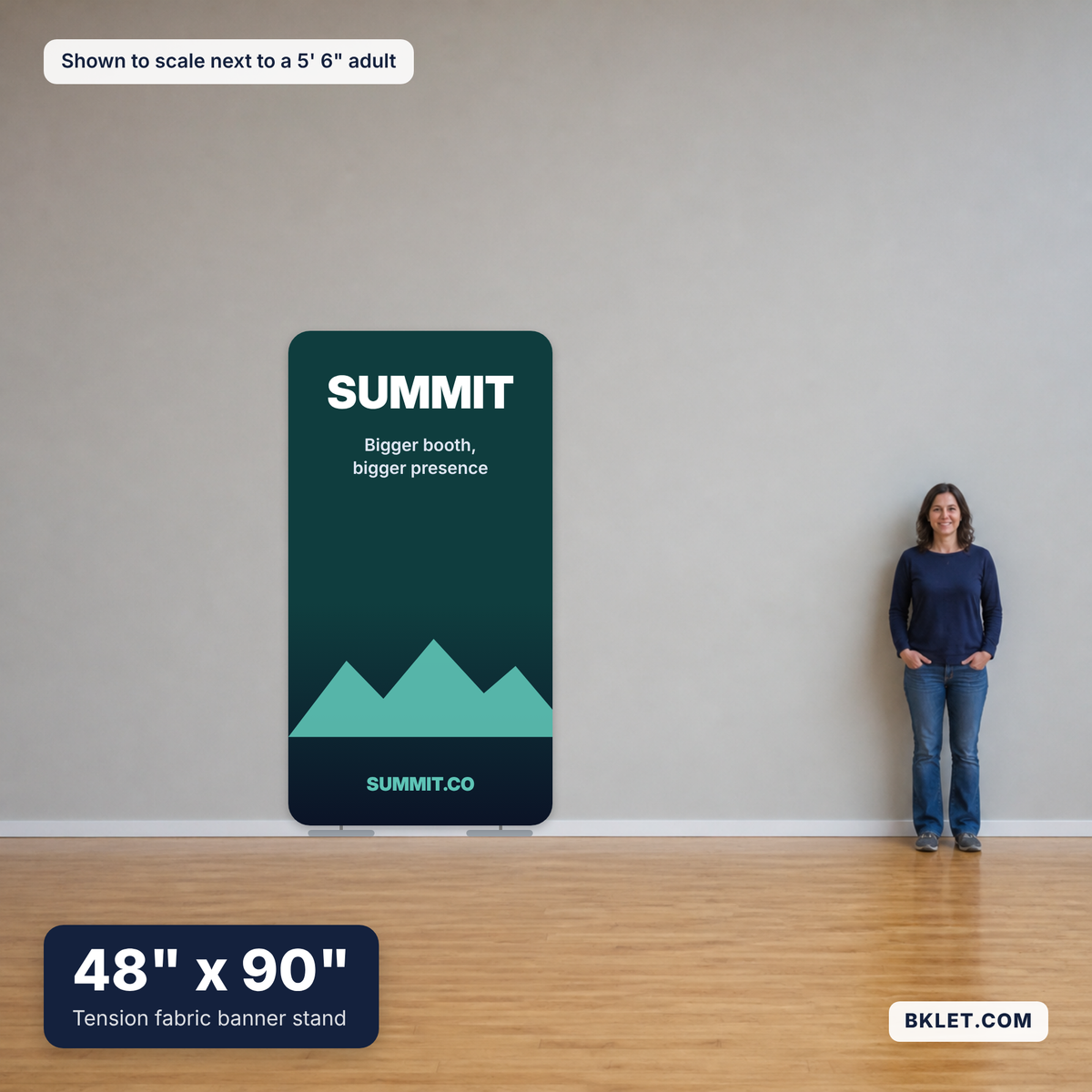 Tension fabric banner stand, 48" x 90", shown to scale next to an adult