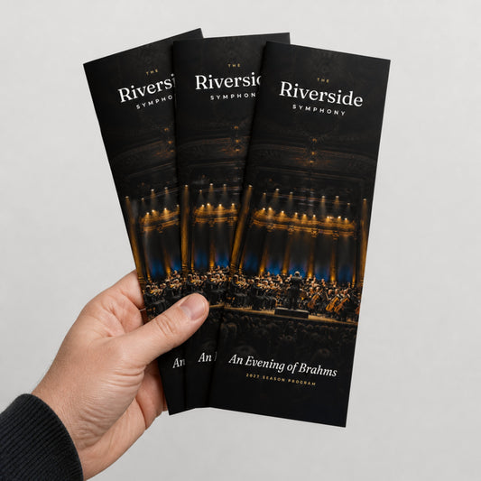Custom 4.25 x 11 saddle-stitched booklets held in hand