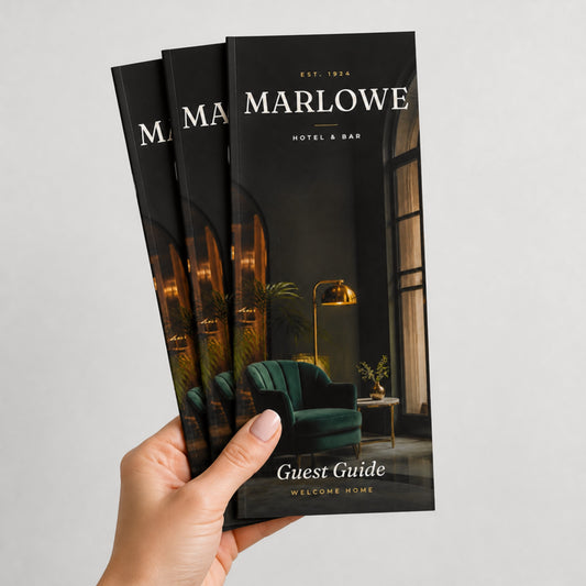 Custom 4 x 9 saddle-stitched booklets held in hand