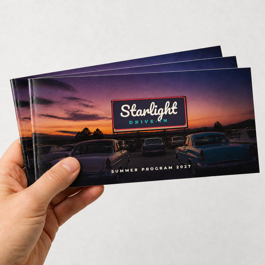 Custom 9 x 4 landscape saddle-stitched booklets held in hand