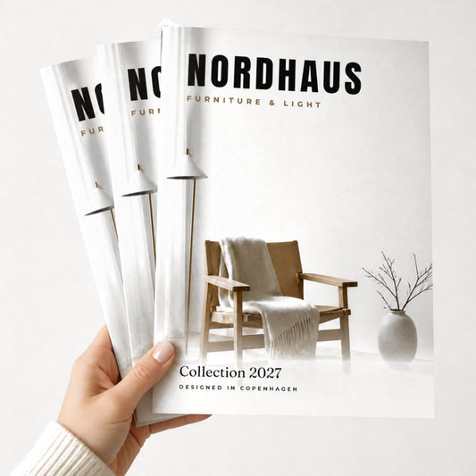 Custom A4 (210 x 297 mm) saddle-stitched booklets held in hand