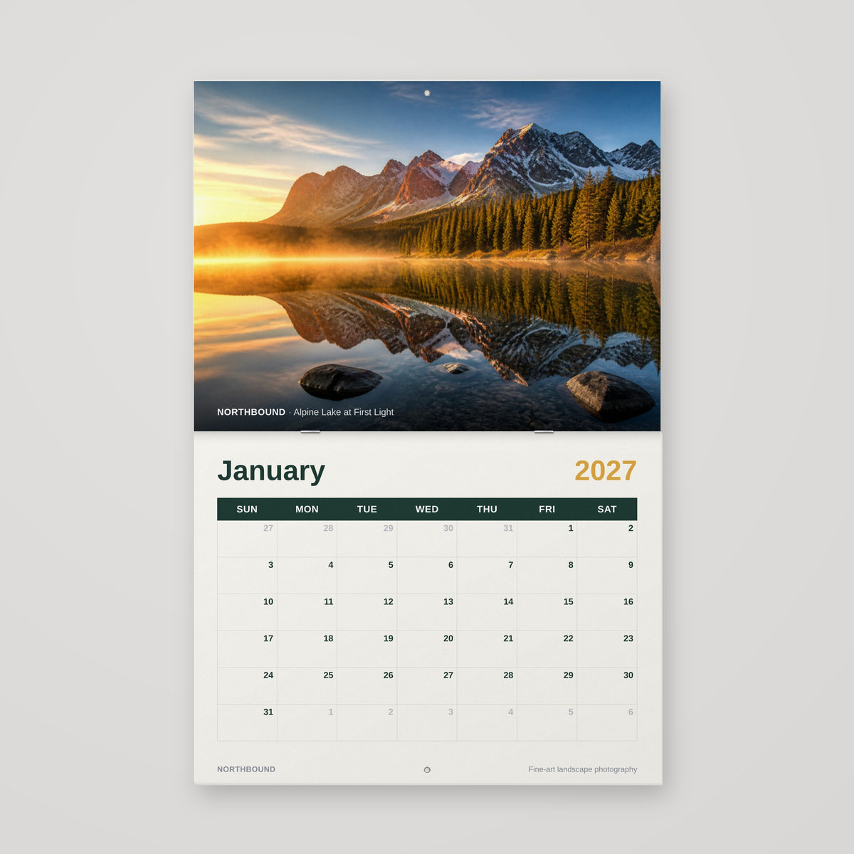 12 x 9 saddle-stitched wall calendar hanging open with hang holes