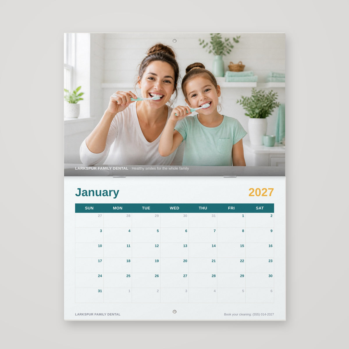 8.5 x 5.5 saddle-stitched wall calendar hanging open with hang holes