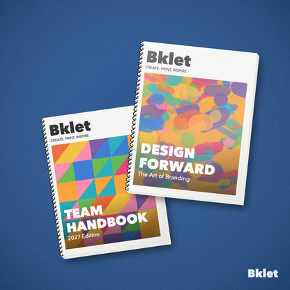 Custom spiral bound books with clear front cover and black back, printed by Bklet